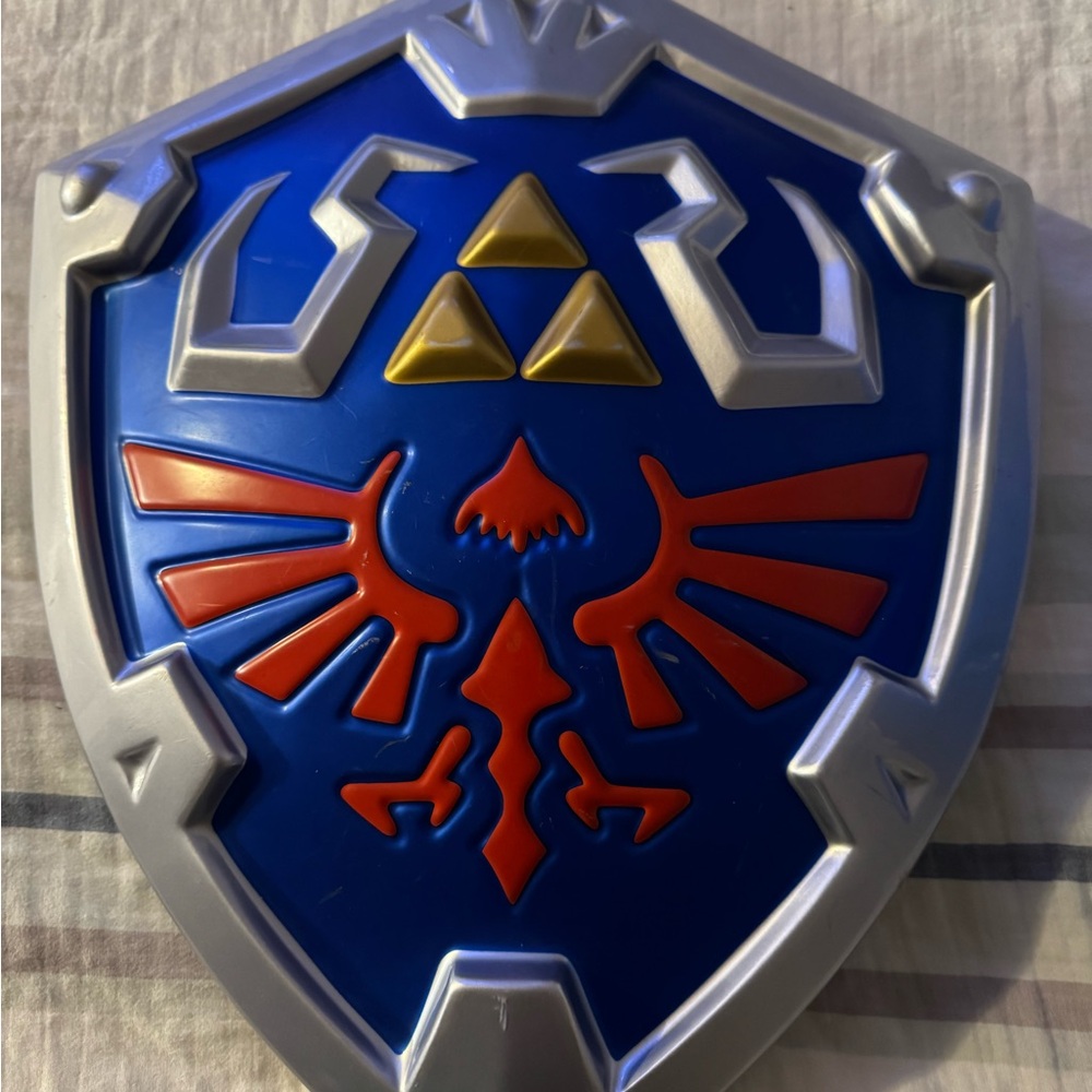 Zelda Disguise plastic  Shield with Red and in Gold Details